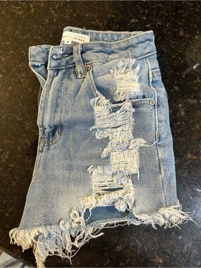 Almost Famous Light Blue Denim Skirt with Branded Button